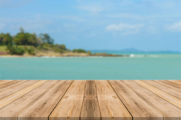 istock Vintage wooden board empty table blue sea background. 494153506