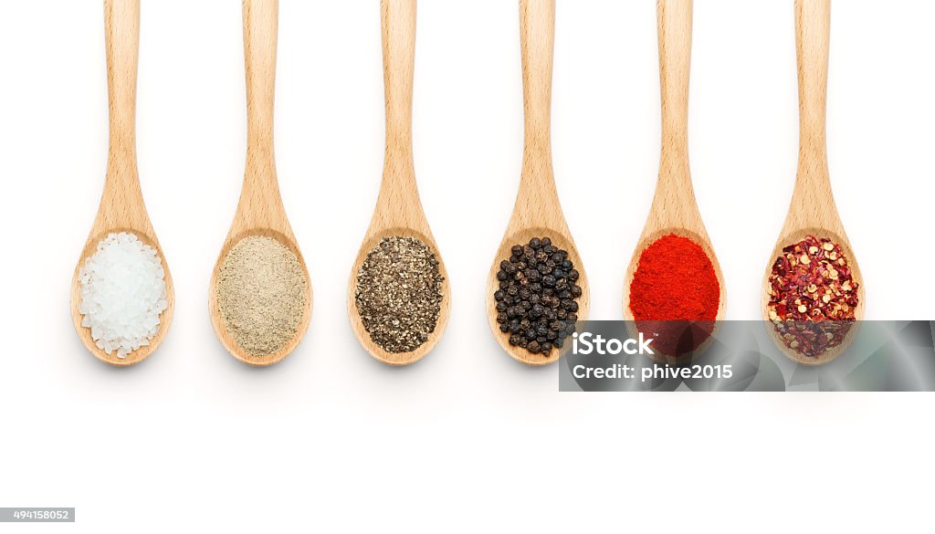 Wooden Spoon Filled With Various Spices Stock Photo - Download