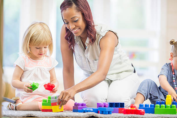 istock Little Girls Playing with Blocks 494158164