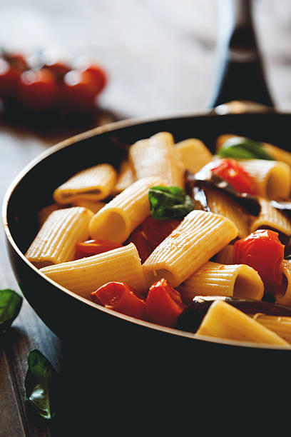 istock italian pasta with cherry tomato eggplant and basil 494159760