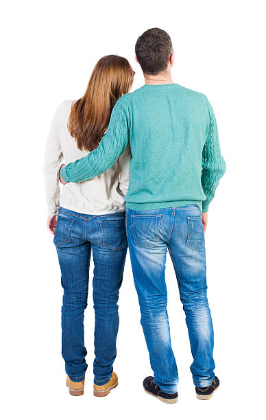 istock Back view of young embracing couple 494160108