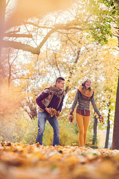 istock Cheerful couple having fun in autumn park and laughing. 494161500