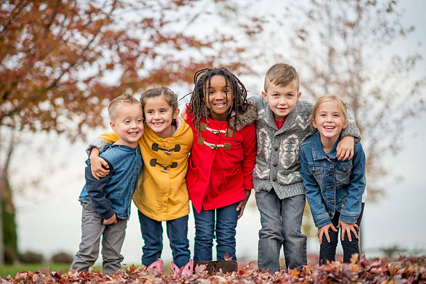 Kids Standing Together in a Row at the Park