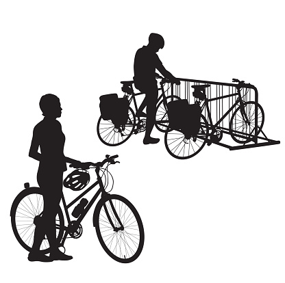 A vector silhouette illustration of a man and a woman with bicycles.  The woman stands beside hers while the man pulls his up to a bike rack.