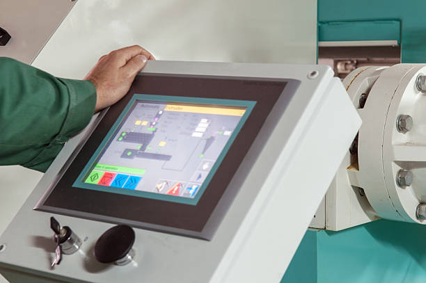 istock man operating factory machinery 494165090