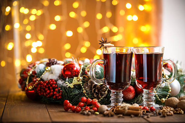 istock Christmas hot mulled wine with spices on a wooden table. 494165128