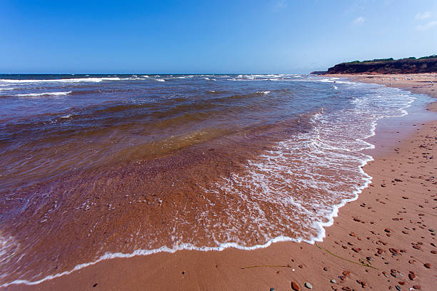 red sandy beach on north shore of Prince Edward Island