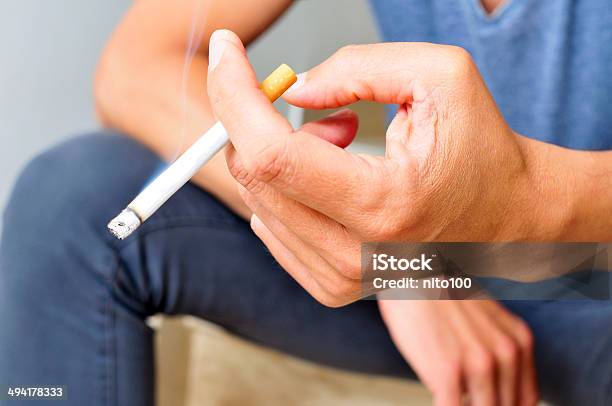 Young Man Smoking Stock Photo - Download Image Now - Addiction, Adult, Cigarette