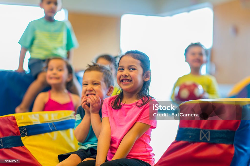Toddlers Playing Diverse group of toddlers playing together. School Gymnasium Stock Photo