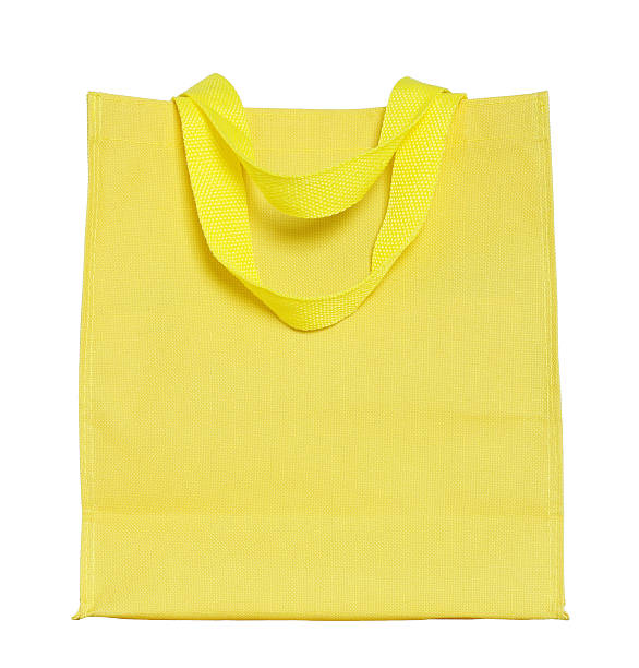 istock yellow canvas shopping bag isolated on white 494181517