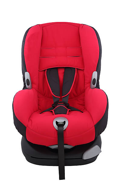 Red toddler car seat on isolated stock photo