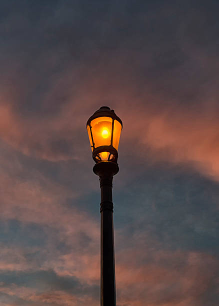 istock Street lamp lit at sunset 494183048