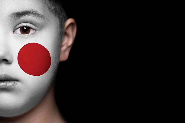 istock Human face painted with flag of Japan 494183589