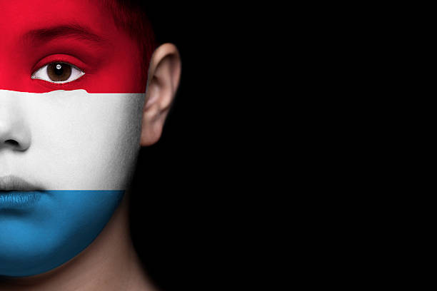 istock Human face painted with flag of Luxembourg 494183803