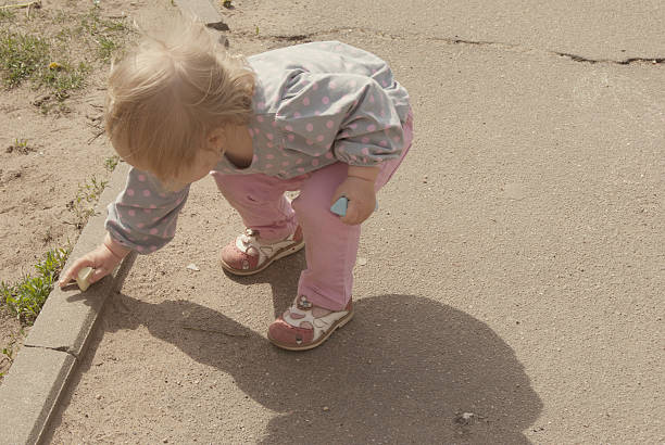 istock Child drawing on the pavement border 494184342
