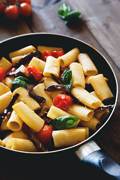 istock italian pasta with cherry tomato eggplant and basil 494184488