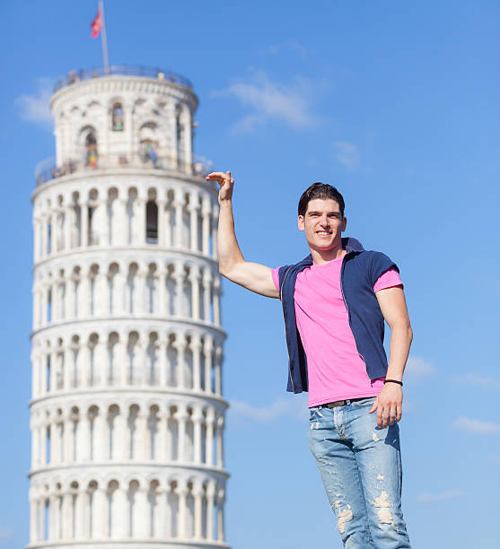 istock Young Man and Leaning Tower of Pisa 494184859