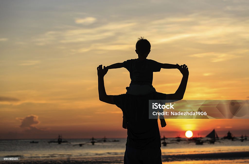 happy family on sunset beach father and son on sunset beach Activity Stock Photo