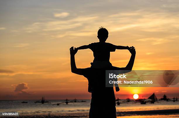 Happy Family On Sunset Beach Stock Photo - Download Image Now - Activity, Adult, Beach