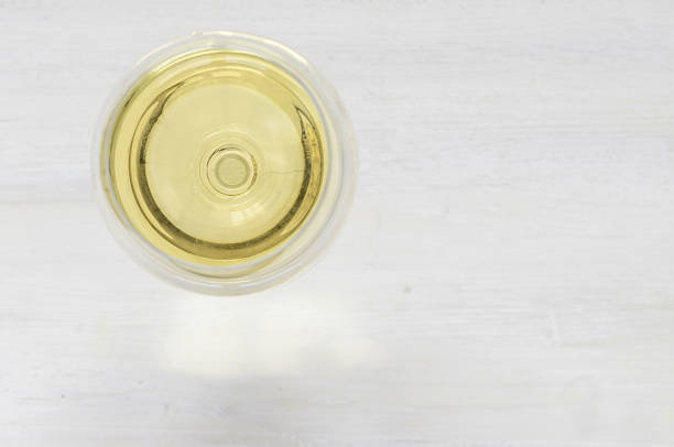 istock White wine glass on a white background 494186180
