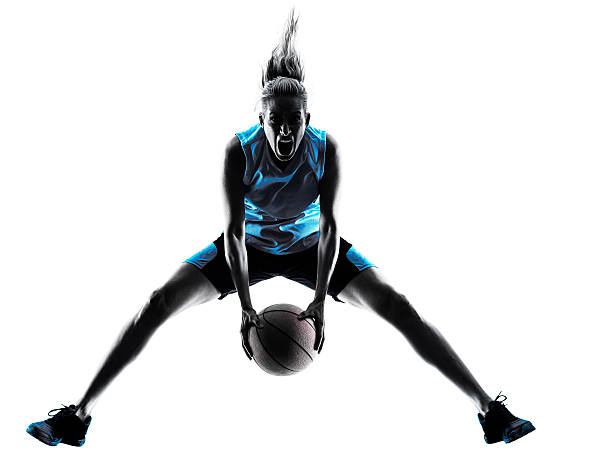 femme silhouette de joueur de basket-ball - womens basketball photos et images de collection