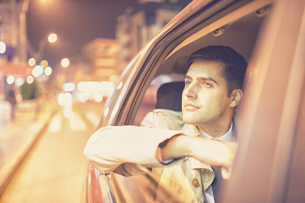 istock Businessman in a car at night 494188270