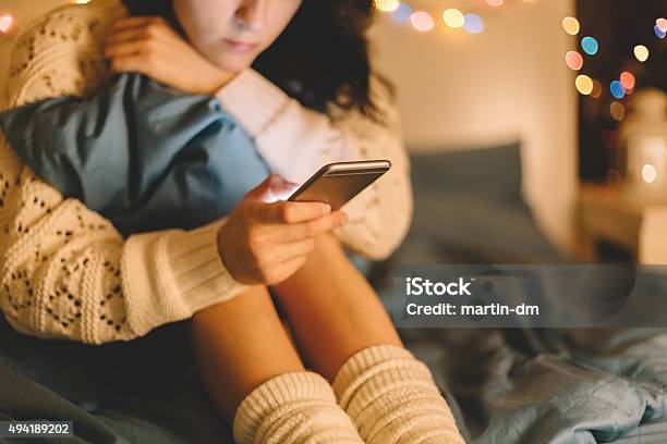Girl In Bed Using Phone Stock Photo - Download Image Now - Teenager, Teenage Girls, Social Media