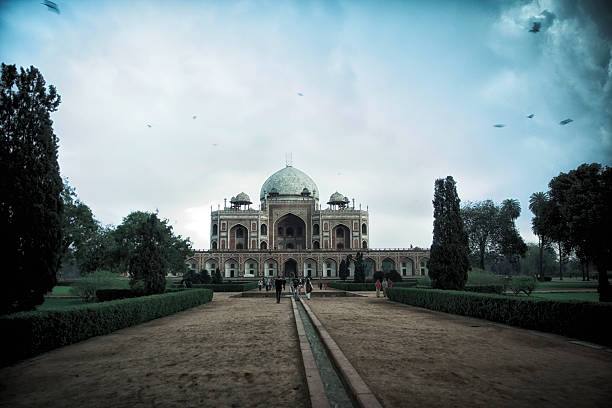 Humayun’s Tomb that famous landmark, which is a Unesco world heritage site, was built at the end of the 1550’s and its architecture is of Mughal style. Non recognizable people can be seen in the image.