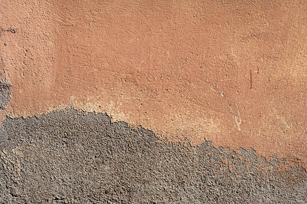 istock Texture of old wall covered with brown stucco 494191566
