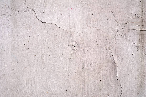 istock Texture of old wall covered with gray stucco 494192112