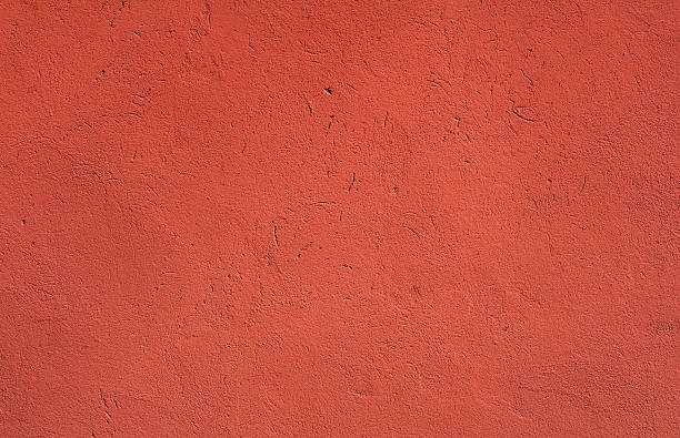 istock Texture of old wall covered with red stucco 494192250