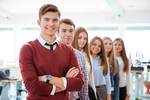 istock Smiling student standing in a line at universit 494192302