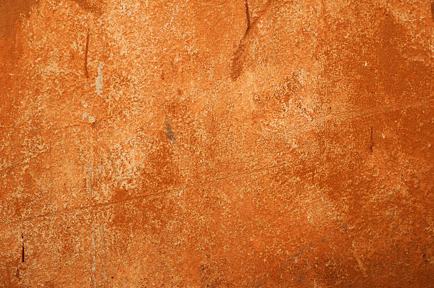istock Texture of old wall covered with brown stucco 494192518