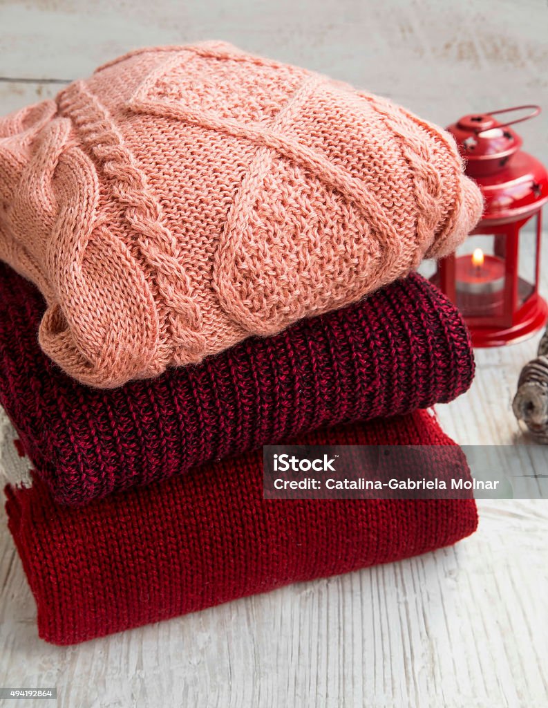 Cozy Woolen Sweaters for Winter Time with Christmas Lantern Cozy Fluffy Woolen Sweaters for Winter Time with Christmas Lantern in the Background 2015 Stock Photo