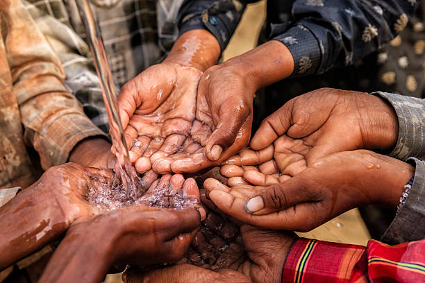 istock Poor African children asking for drinking water 494195212
