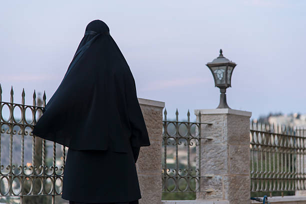 istock Nun watching the view of jerusalem 494196410