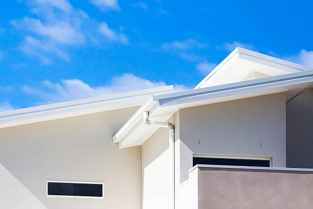istock CLoseup brand new house against blue sky, copy space 494205463