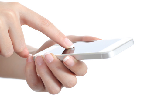 Woman hands holding and touching a smart phone screen isolated on a white background