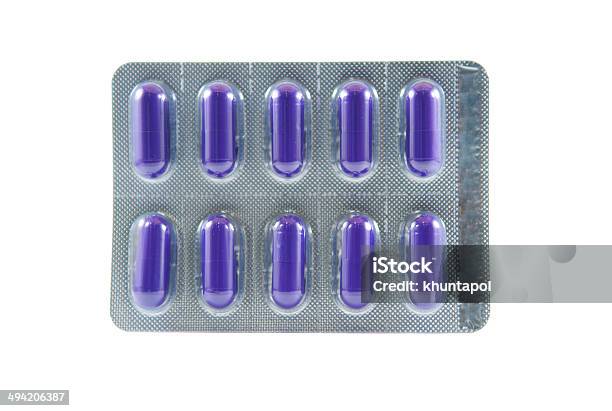Purple Long Capsule In Transparent Blister Pack Stock Photo - Download Image Now - Addiction, Aluminum, Antibiotic