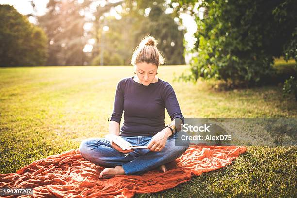 Woman Reading A Book In The Park Stock Photo - Download Image Now - Adult, Adults Only, Book