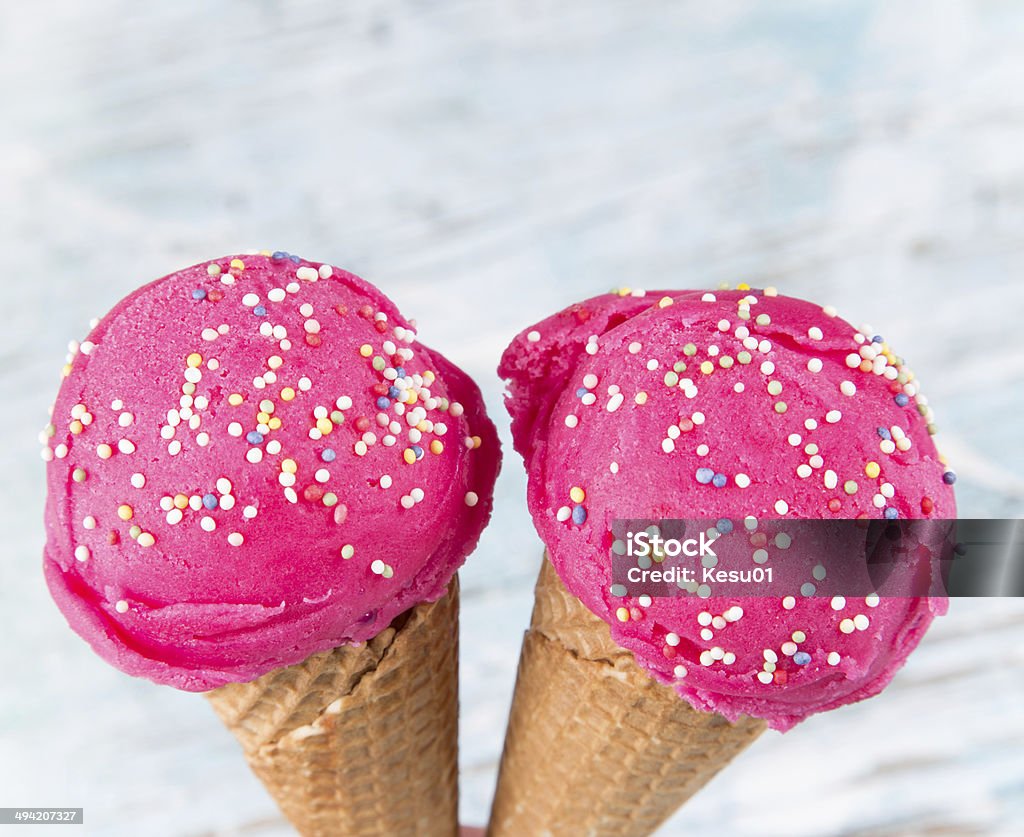 Ice cream scoops on wooden table. Ice cream scoops on wooden table, close-up. Backgrounds Stock Photo