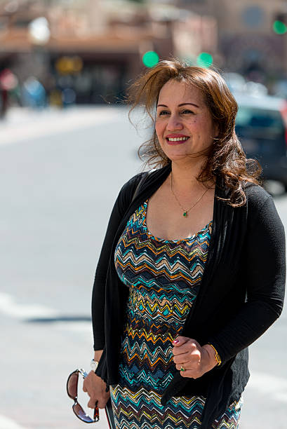 istock Woman standing downtown in black sweater 494207901