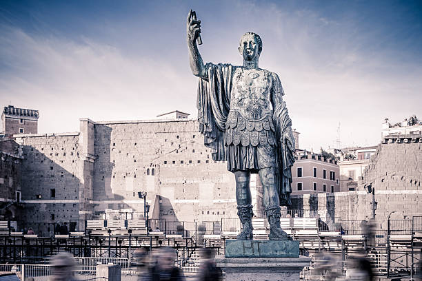 Statue of Gaius Julius Caesar in Rome, Italy Old Statue of Gaius Julius Caesar in via dei Fori Imperiali in Rome, Italy augustus caesar photos stock pictures, royalty-free photos & images