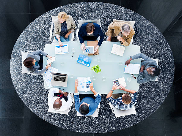 istock Multiethnic Group of People Discussing Statistical Analysis 494208797