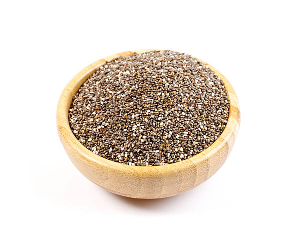 Chia Seeds A heap of organic chia seeds rich in omega-3 fatty acids, isolated on white. salvia hispanica plant stock pictures, royalty-free photos & images