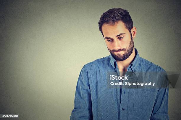 Shy Young Handsome Man Feels Awkward Stock Photo - Download Image Now - Shy, Men, Embarrassment