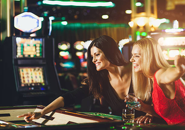 Young people playing roulette at the casino Young people playing roulette at the casino Gambling women stock pictures, royalty-free photos & images