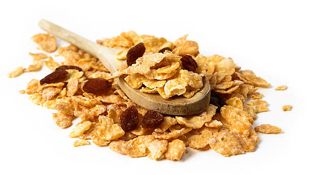 Oat flakes   in the wooden spoon on white background stock photo