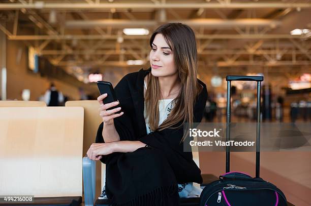 Airport Young Female Passenger Stock Photo - Download Image Now - Airport, Women, Mobile Phone