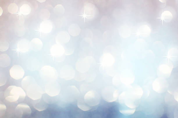 istock Silver white glittering Christmas lights. Blurred abstract backg 494216544